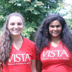 Two VISTA members in matching shirts